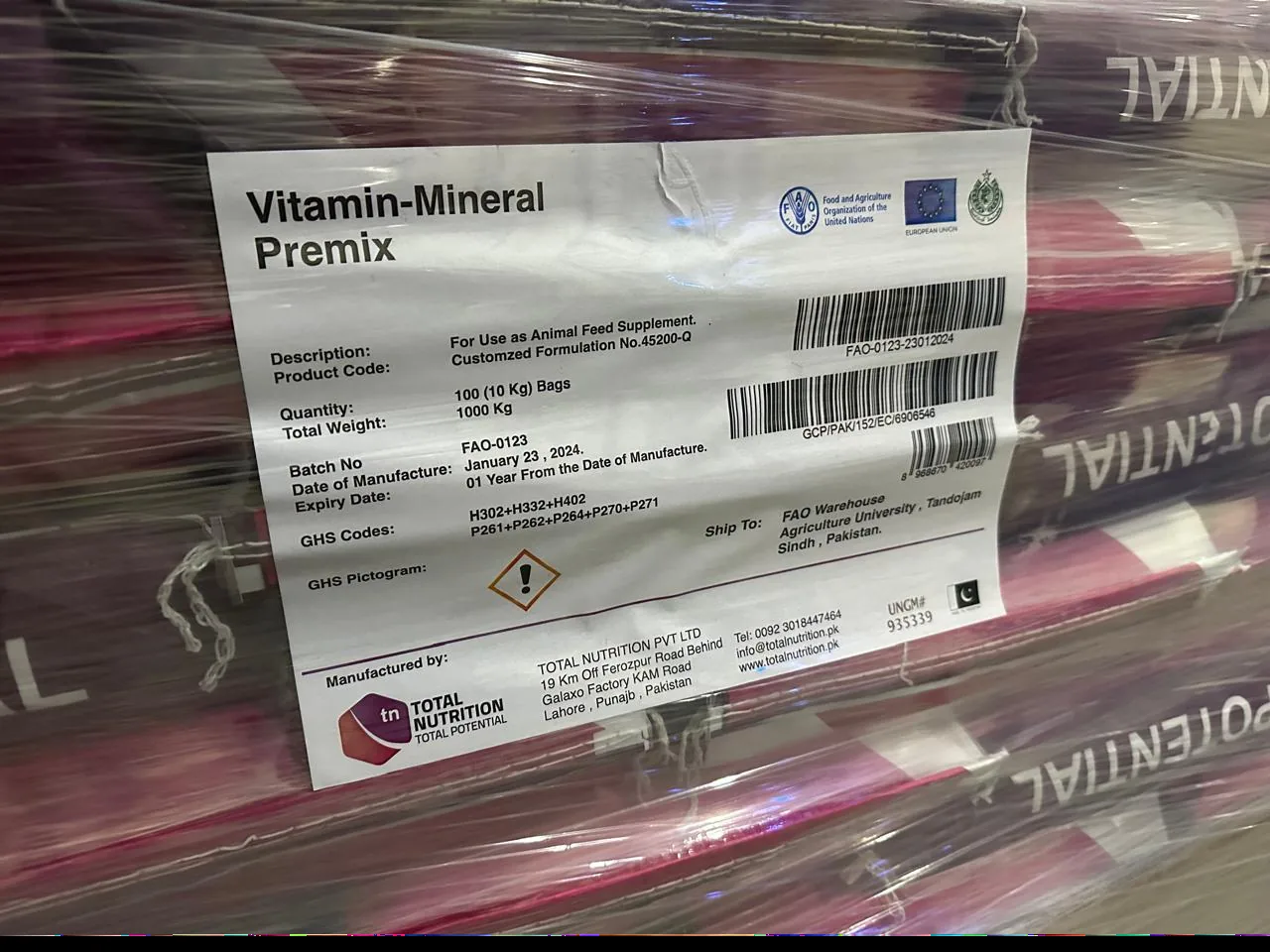 Palletized custom vitamin-mineral premix consignment labelled for an EU-funded FAO project